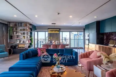Luxurious modern living room with vibrant decor and city view, featuring spacious seating and elegant dining area.