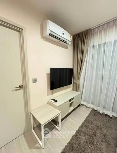 Modern living room with air conditioning and sleek TV setup