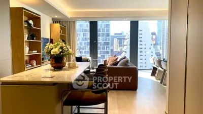 Luxurious modern living room with city view, open layout, and elegant decor.