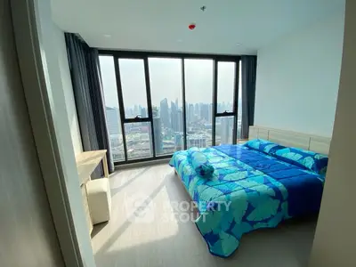 Modern bedroom with stunning city view and large windows