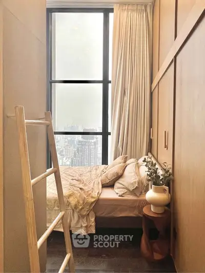 Cozy bedroom with city view, featuring a stylish wooden ladder and elegant decor.