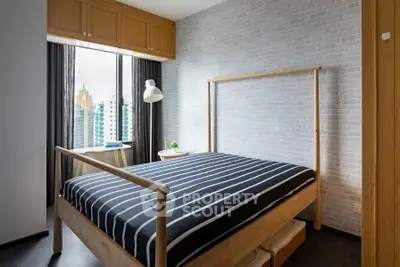 Modern bedroom with city view, featuring stylish wooden bed and striped bedding, perfect for urban living.