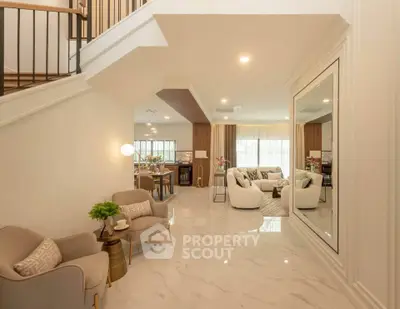 Spacious open-plan living room with elegant decor and modern furnishings