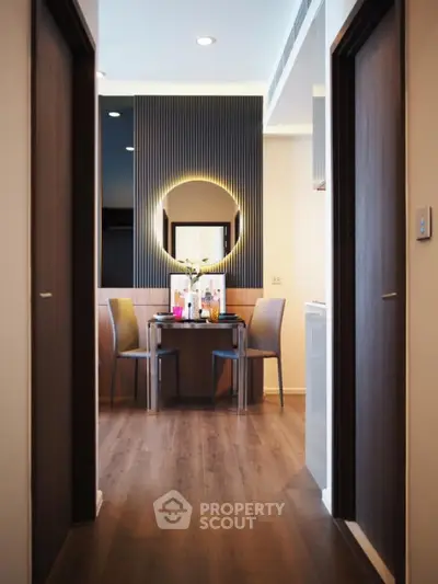 Modern dining area with stylish decor and warm lighting in a contemporary apartment
