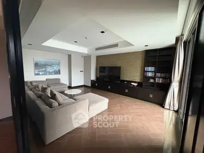 Spacious modern living room with sectional sofa and entertainment center
