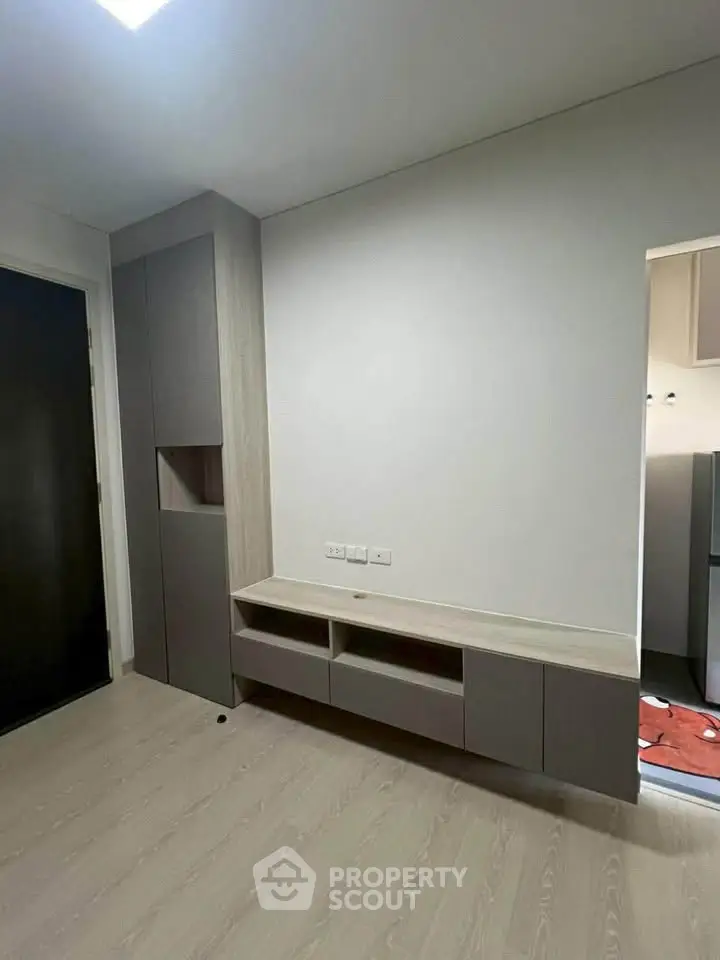 Modern minimalist living room with built-in storage and sleek design