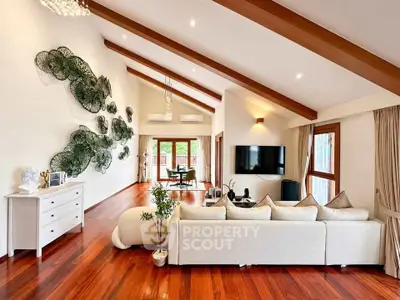 Spacious living room with vaulted ceiling and elegant decor in modern home