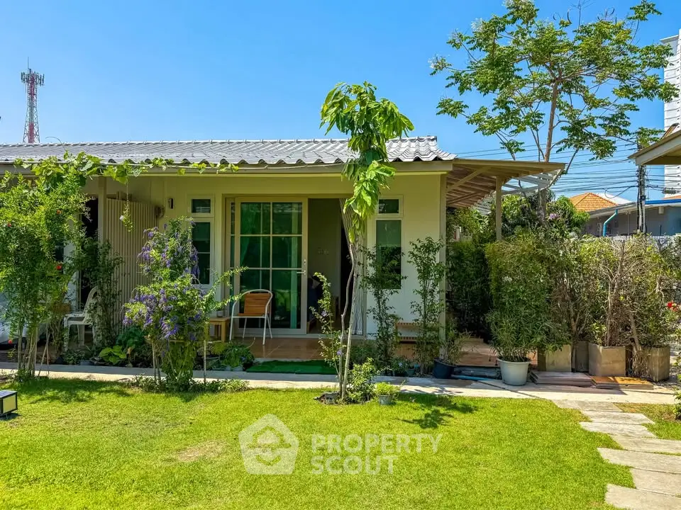 Charming single-story home with lush garden and inviting patio, perfect for tranquil living.