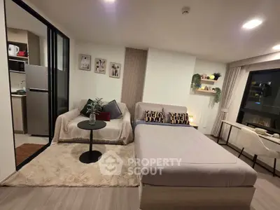 Modern studio apartment with cozy living area and stylish decor
