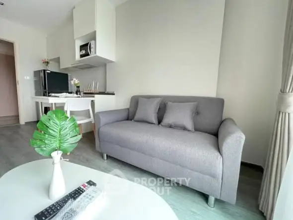 Modern living room with gray sofa and stylish decor