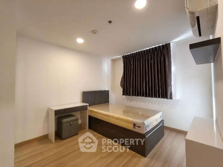 Modern living room with stylish wall design and recessed lighting