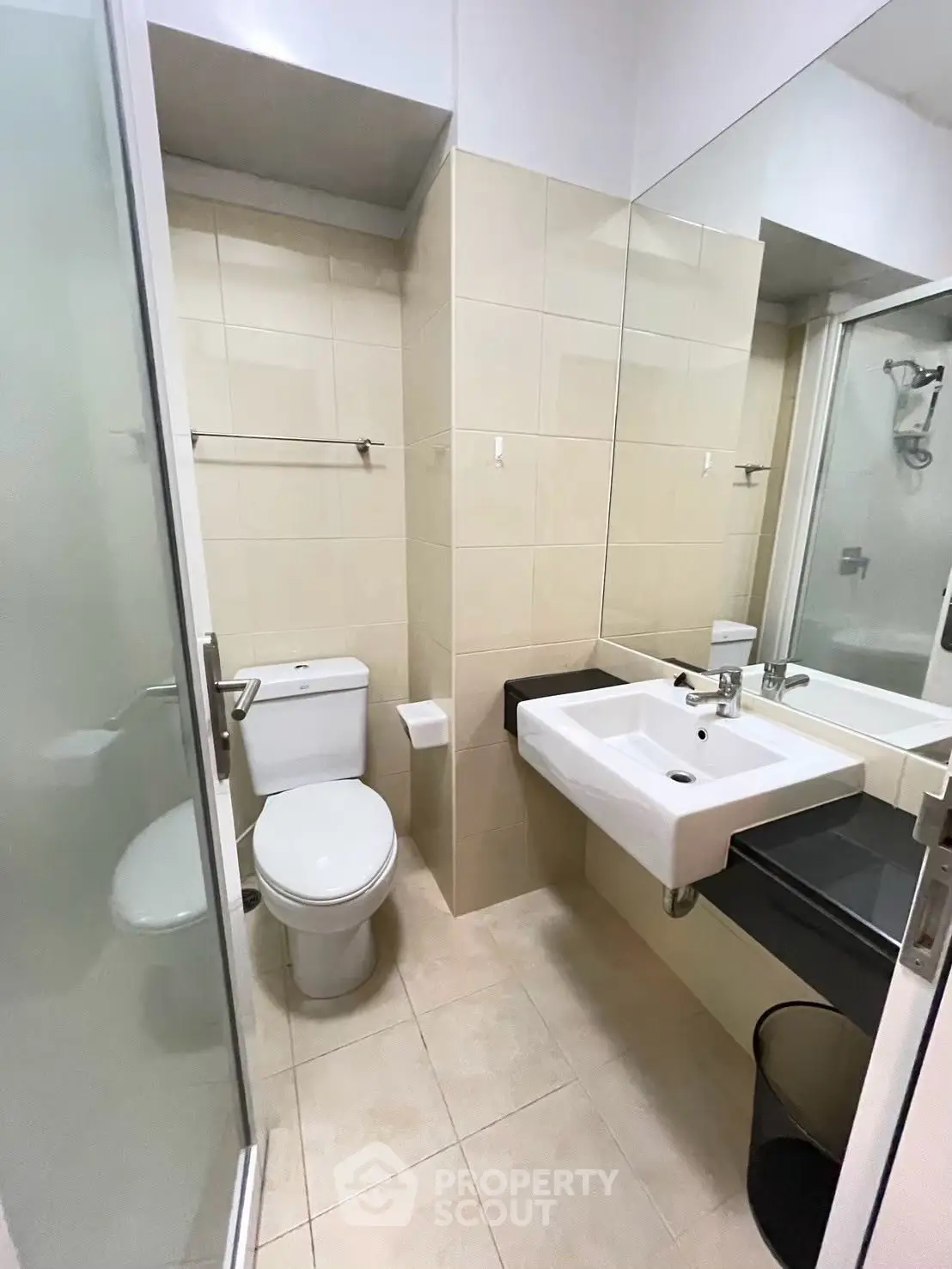 Modern bathroom with sleek fixtures and glass shower enclosure