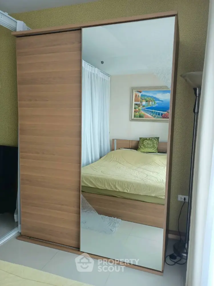 Modern bedroom with mirrored wardrobe and stylish decor