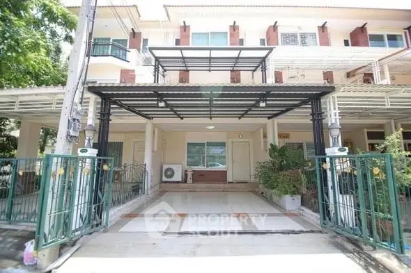 Spacious townhouse with covered parking and modern exterior design in a serene neighborhood.