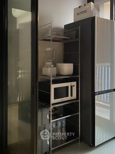 Modern kitchen corner with sleek appliances and storage solutions