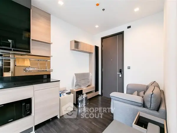 Modern living room with sleek furniture and stylish decor in a contemporary apartment.