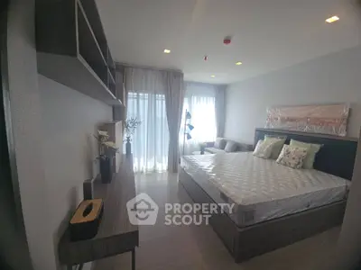 Modern bedroom with stylish decor and natural light