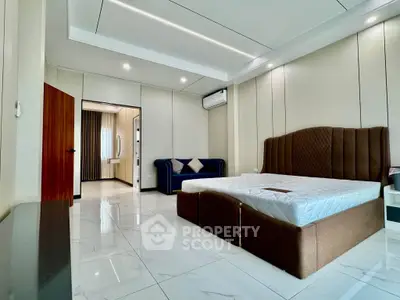 Spacious modern bedroom with elegant design and luxurious furnishings