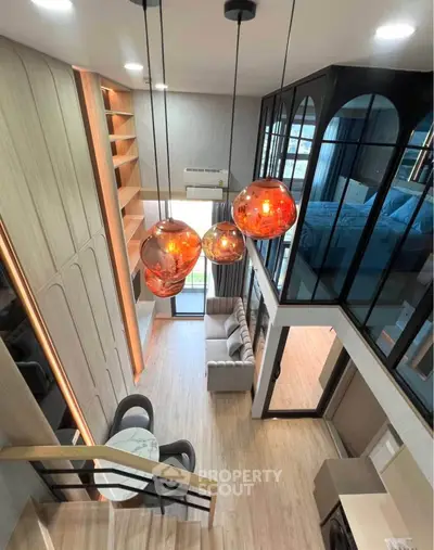 Stunning modern loft with open layout, stylish lighting, and cozy living area, perfect for urban living.