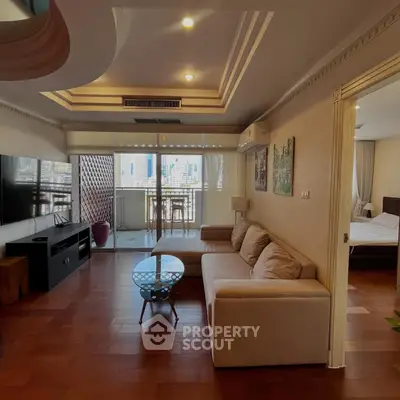 Spacious living room with modern decor and balcony view in urban apartment