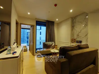 Modern living room with elegant marble accent wall and cozy seating area in a high-rise apartment.