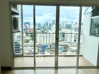 Spacious balcony with stunning cityscape view from high-rise apartment