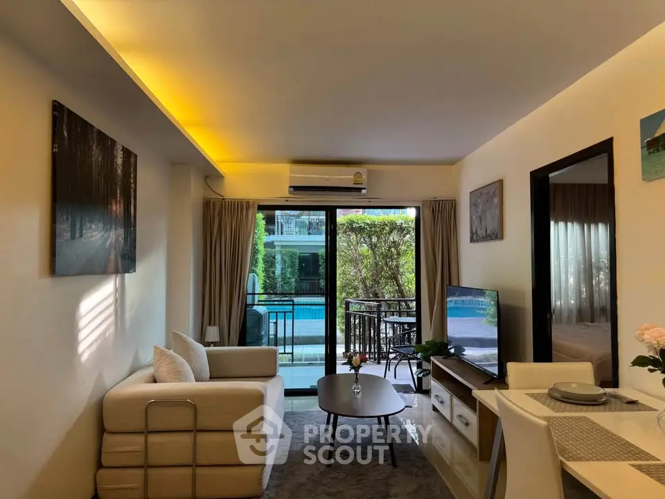 Chic living room with pool view, modern decor, and cozy seating in a stylish apartment.