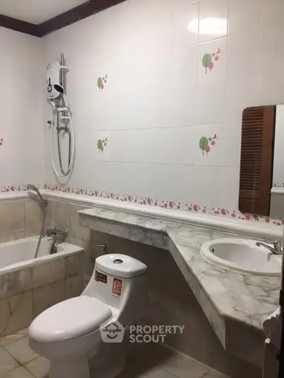 Charming bathroom with bathtub and elegant marble countertop