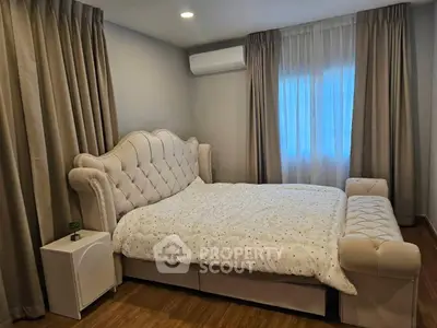 Luxurious bedroom with elegant bed and cozy ambiance, perfect for relaxation.