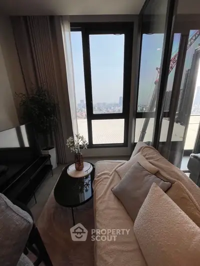 Stylish living room with cozy seating and panoramic city view