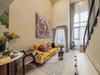 Modern living room with high ceilings and stylish decor in a luxury apartment