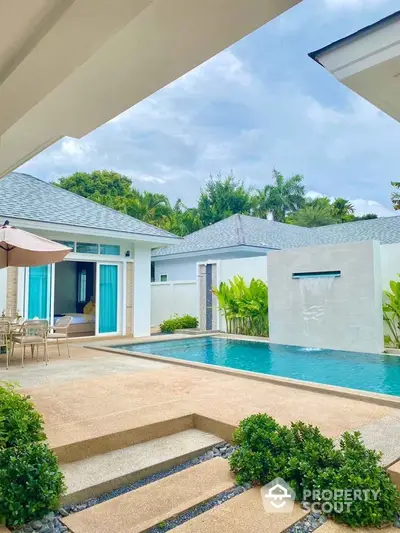 Luxurious villa with private pool and lush garden, perfect for relaxation and entertaining.