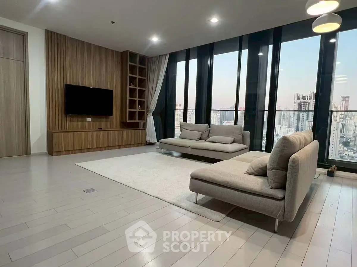 Spacious modern living room with city view and elegant decor