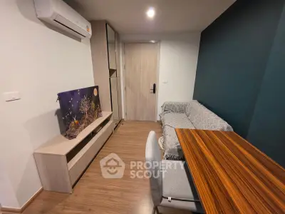 Modern living room with sleek furniture and air conditioning, perfect for urban living.
