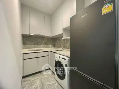 Modern kitchen with sleek appliances and stylish cabinetry