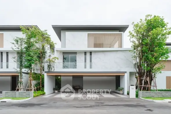 Modern luxury house exterior with sleek design and lush greenery