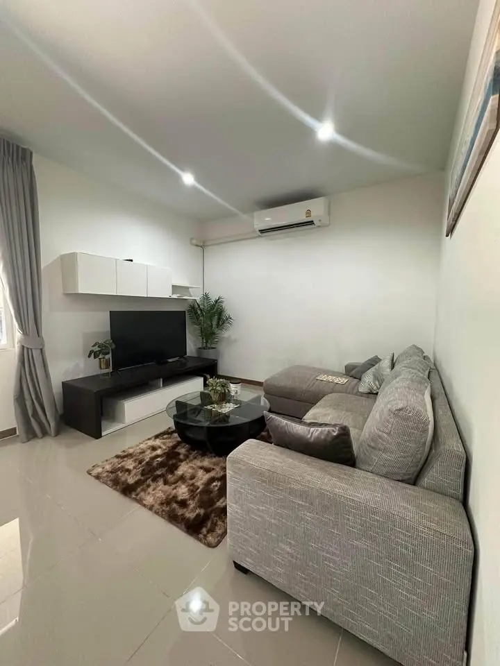 Modern living room with sleek furniture and cozy ambiance