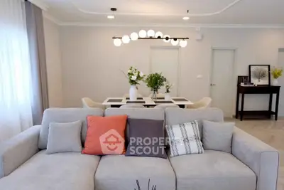 Modern living room with stylish sofa and elegant dining area