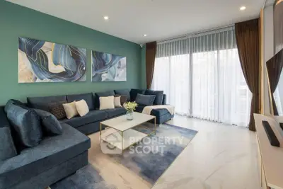 Elegant living room with modern blue sofa and abstract art