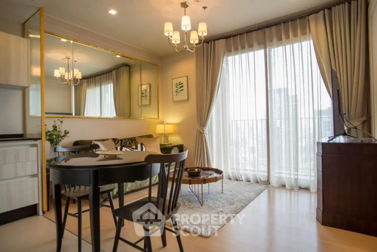 Elegant living room with large mirror and city view balcony