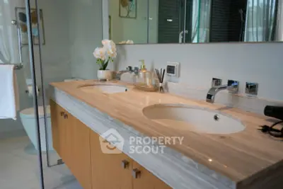 Luxurious modern bathroom with dual sinks and elegant decor