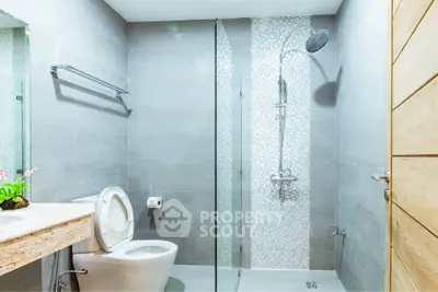 Modern bathroom with sleek design and glass shower enclosure