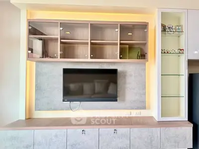 Modern living room with sleek TV unit and stylish cabinetry