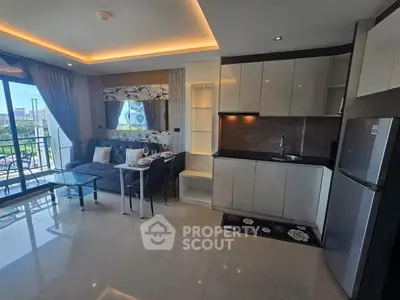 Modern open-layout living room and kitchen with balcony view in stylish apartment.