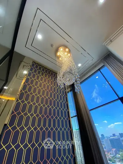 Luxurious high-rise apartment with stunning chandelier and city view