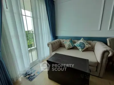 Charming living room with elegant sofa and balcony view