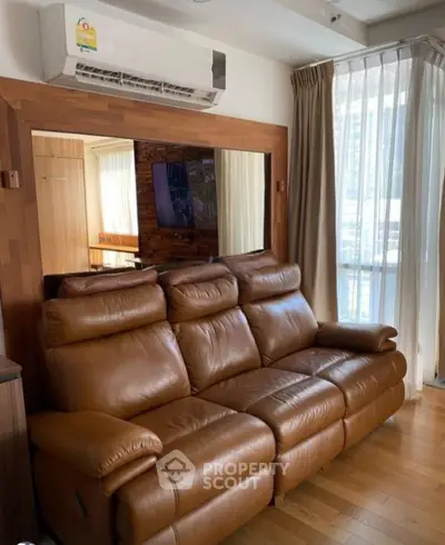 Luxurious living room with leather sofa and modern air conditioning unit