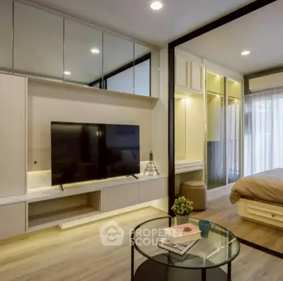 Modern living room with sleek TV unit and cozy bedroom view