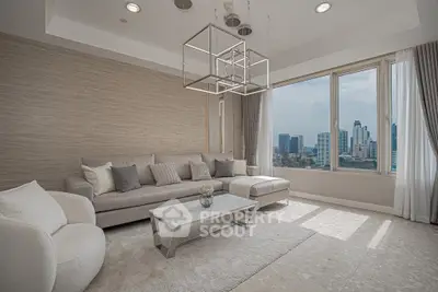 Luxurious modern living room with stunning city view, elegant furnishings, and abundant natural light.