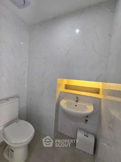 Modern bathroom with sleek design and ambient lighting